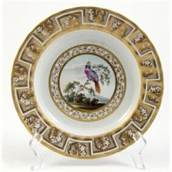 A Derby cabinet plate, circa 1800, with circular gilt laurel border enclosing a brightly enamelle...