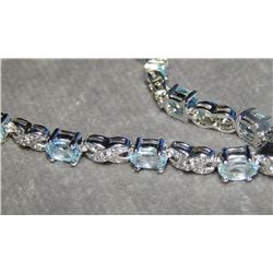 BRACLET - 6+ CT BUE TOPAZ INFINITY DESIGN BRACELET WITH DIAMOND - INCLUDES $450 CERTIFICATE