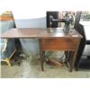 Image 2 : ANTIQUE NEW HOME TREADLE SEWING MACHINE IN CABINET
