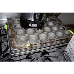 STACK OF BAKING & MUFFIN PANS