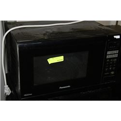 BLACK PANASONIC OR MAGIC CHEF MICROWAVE  AS THE