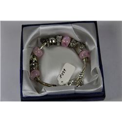 SILVER CHARM BRACELET PINK STONES