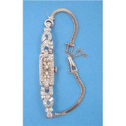 A diamond set platinum cocktail watch with rectangular arabic dial and later snake link bracelet....