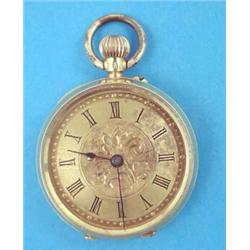 An 18k gold keyless fob watch with gilt roman dial....