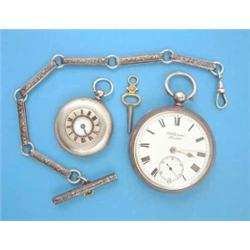 A late Victorian silver pocket watch by J W Benson, a half hunter fob watch and a fob chain....