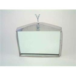A chromium plated novelty mirror, loosely modelled on a Rolls Royce radiator grill with an imitat...