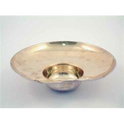 A turn of the century brass shaving bowl of typical form...