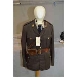 Brown RCMP Tunic w/ shirt, tie, w/ leather Sam Browne strap & holster on mannican