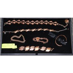 DISPLAY FILLED WITH COPPER JEWELLERY