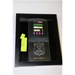 BASIN CITY POLICE BADGE IN GLASS CASE