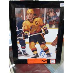 Autographed Stan Smyl hockey photo