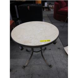Stone top end table on metal base