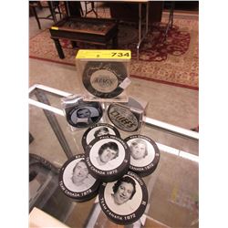 8 Hockey pucks - 2 Signed