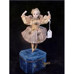 14in. MECHANICAL DOLL