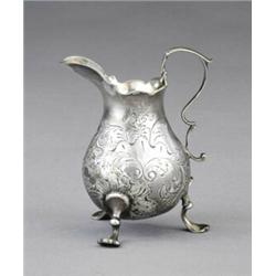 A George II pear shaped cream pitcher,...