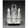 Image 1 : A Victorian seven-bottle oval cruet frame,...