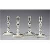 Image 1 : A set of four cast candlesticks,...