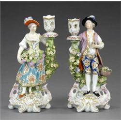 A pair of Chelsea candlestick figures,...