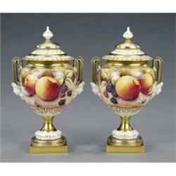 A pair of Royal Worcester vases and covers,...