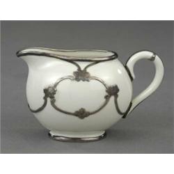 A Belleek oval cream jug,...