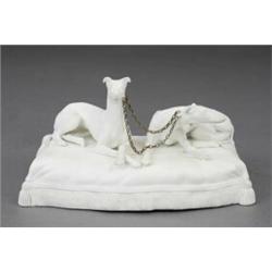 A Parian model of a pair of seated greyhounds,...