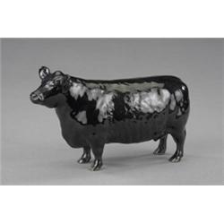 A Beswick model of an Aberdeen Angus cow,...