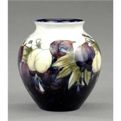 A Moorcroft Wisteria pattern small ovoid vase,...