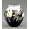 Image 1 : A Moorcroft Wisteria pattern small ovoid vase,...