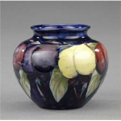 A Moorcroft Wisteria pattern small ovoid vase,...