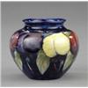 Image 1 : A Moorcroft Wisteria pattern small ovoid vase,...