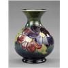 Image 1 : A Moorcroft Clematis pattern baluster vase,...