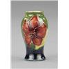 Image 1 : A Moorcroft Hibiscus pattern miniature baluster vase,...