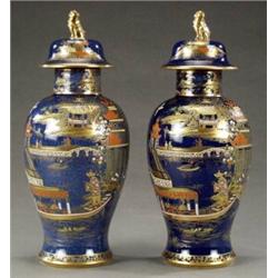 A composed pair of Wiltshaw & Robinson Carlton Ware baluster vases and covers,...