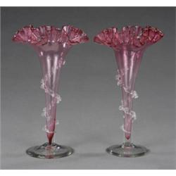 A pair of pale cranberry frilled tapering vases,...