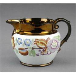 A copper lustre bulbous jug,...