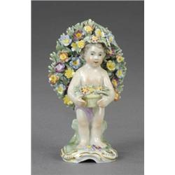 A French figure of a putto,...