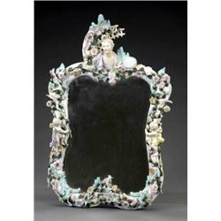 A Dresden shaped rectangular wall mirror,...