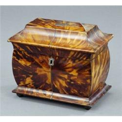 An early Victorian tortoiseshell veneered two compartment tea caddy,...