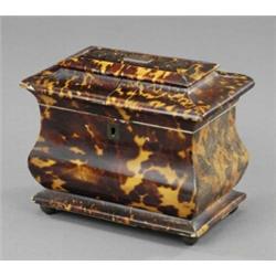 An early Victorian tortoiseshell veneered two compartment tea caddy,...