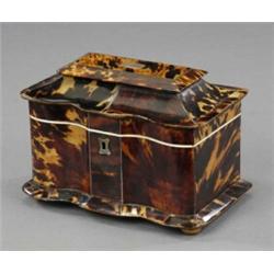A William IV tortoiseshell veneered two compartment tea caddy,...