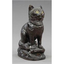 A late 19th century Bavarian carved wood figure of a seated cat,...