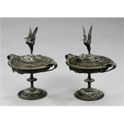 A pair of Victorian bronze pedestal urns and covers,...