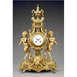A French gilt metal and green onyx mantel clock,...