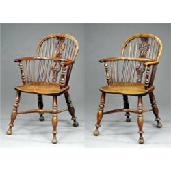 A fine pair of yew low back 'best' Windsor elbow chairs,...
