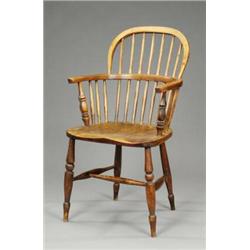 An ash and elm low stick back Windsor elbow chair,...