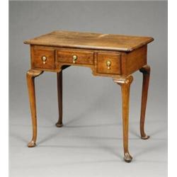 A George II oak lowboy,...