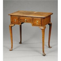 A George II oak lowboy,...