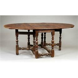 An oak oval gateleg dining table,...