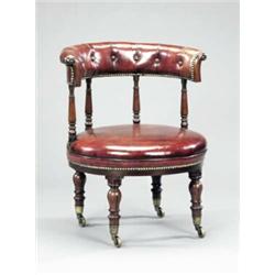 An early Victorian mahogany circular library chair,...
