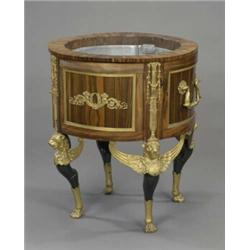 A Napoleon III ormolu mounted coromandel veneered cylindrical jardiniere,...